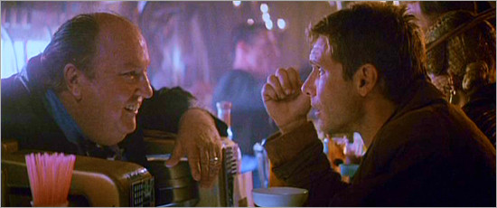 The bartender offers Deckard advice.